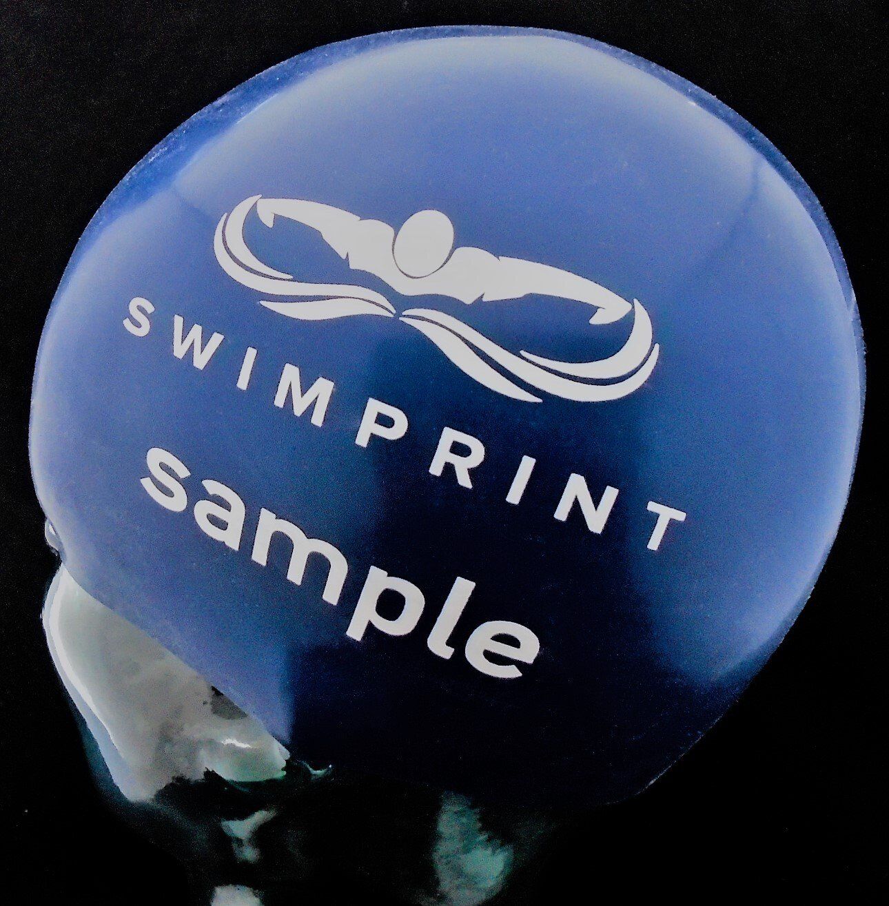 A blue swimming helmet that says swimprint sample on it