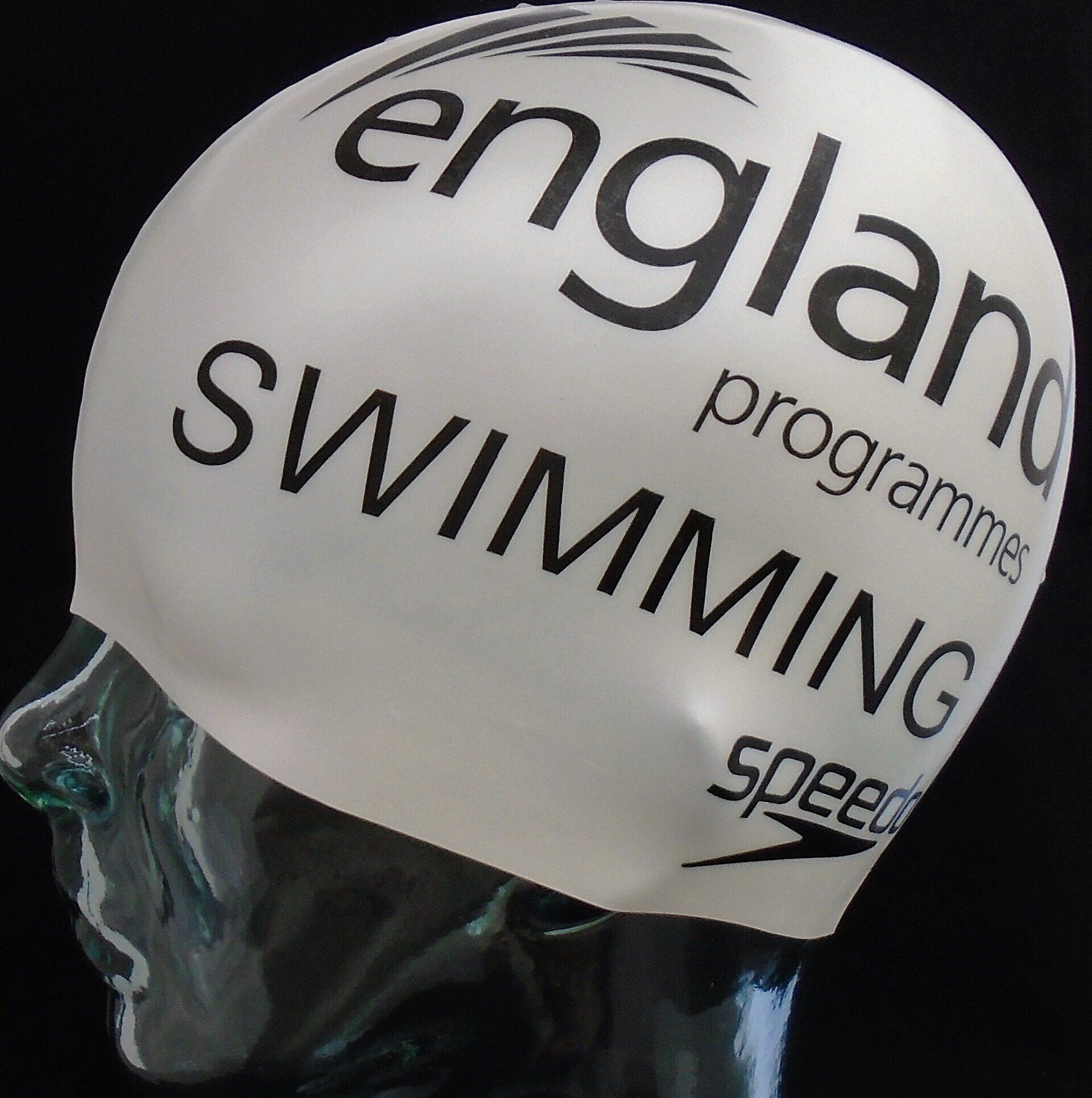 A speedo swim cap is on a mannequin head