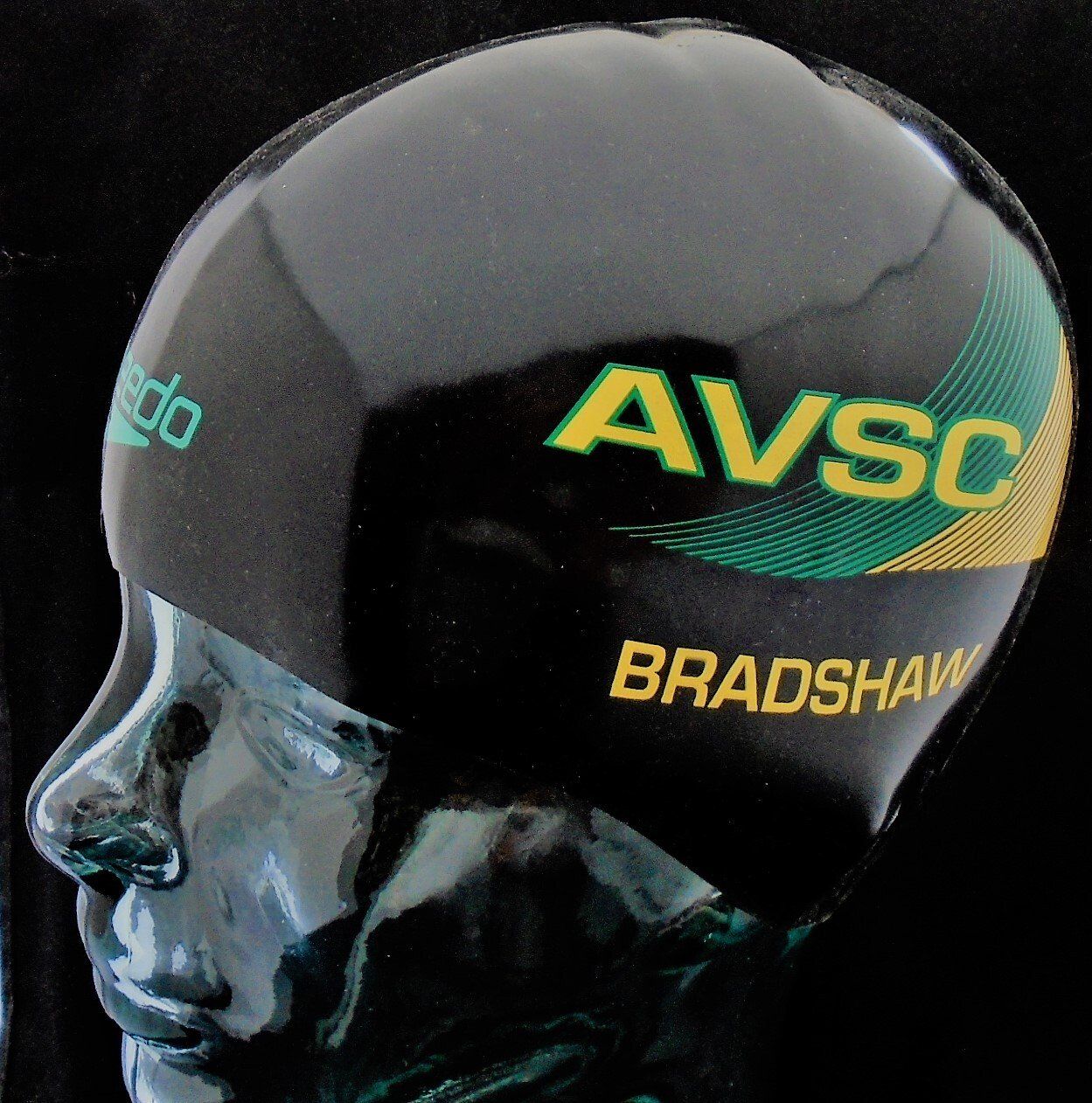 A black helmet that says avsc bradshaw on it
