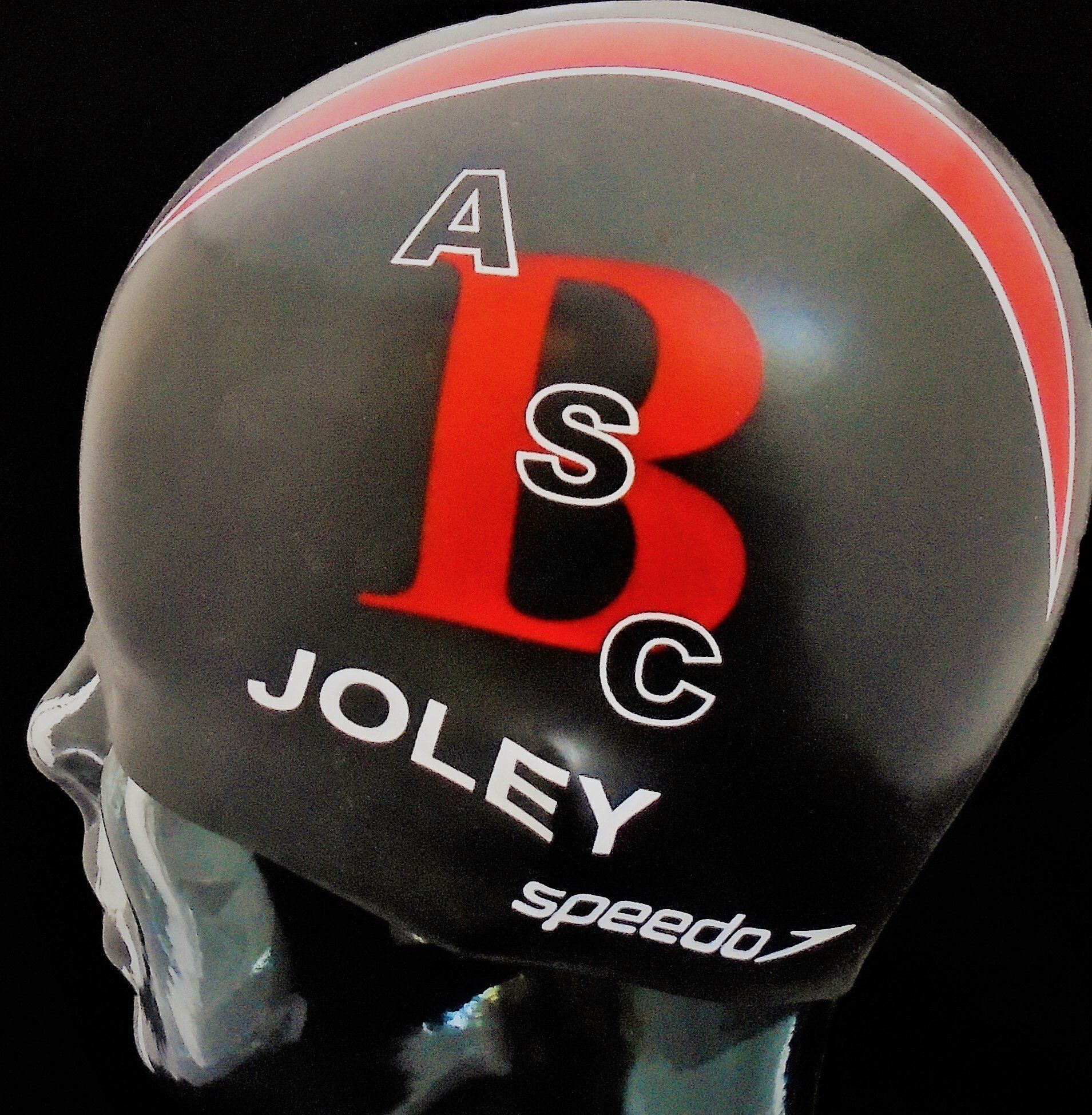 A speedo swim cap with the name joley on it