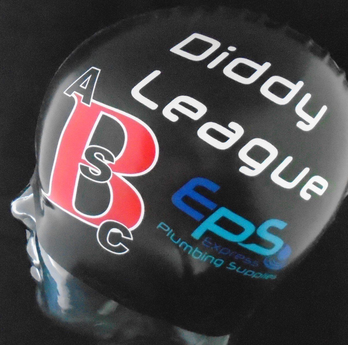 A diddy league eps plumbing supplies swim cap on a mannequin head