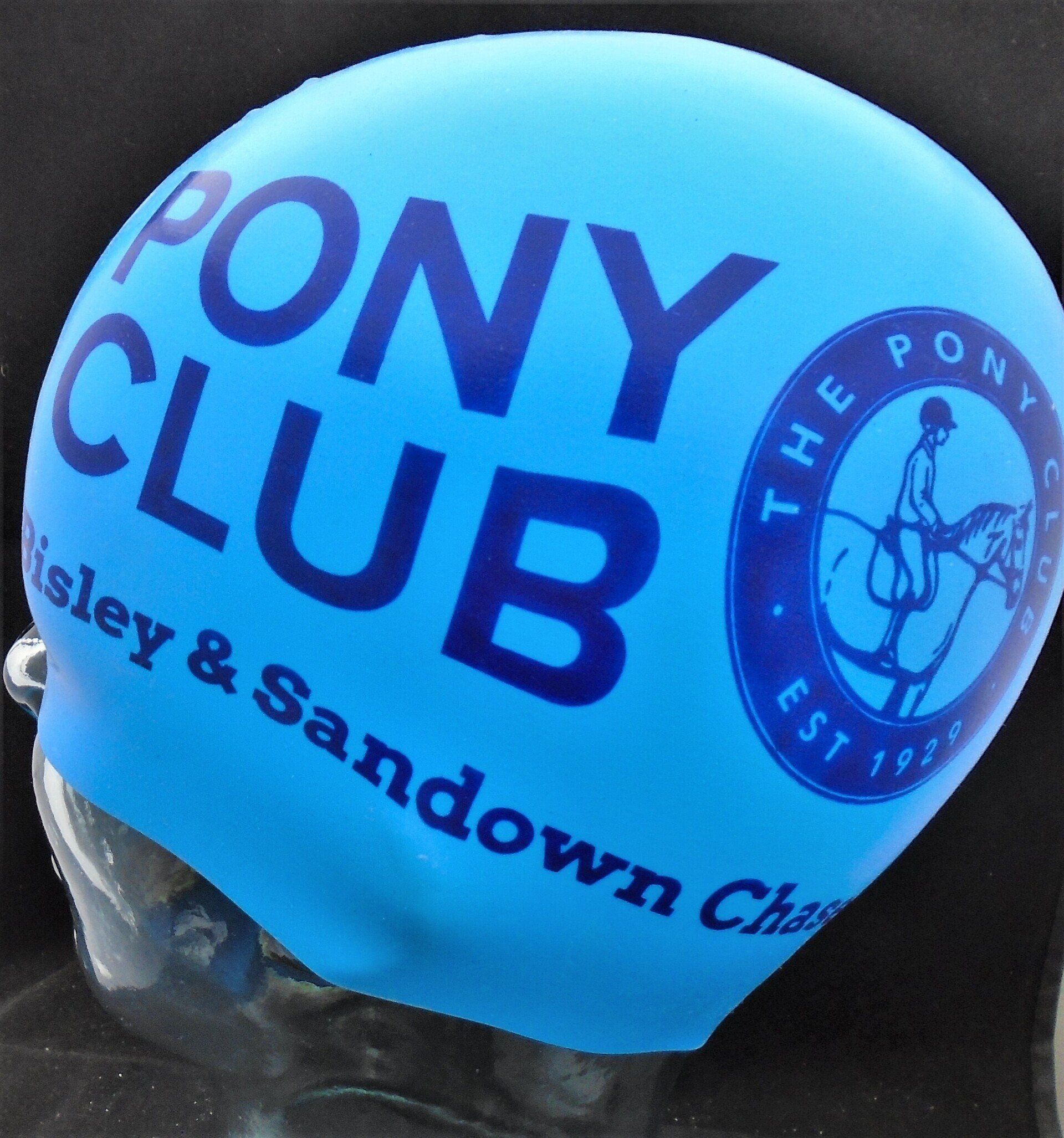 A blue swim cap that says pony club on it