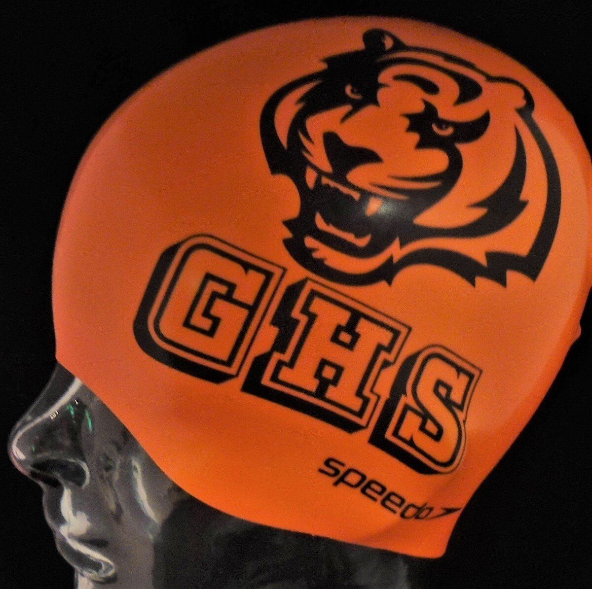 A speedo swim cap with ghs written on it