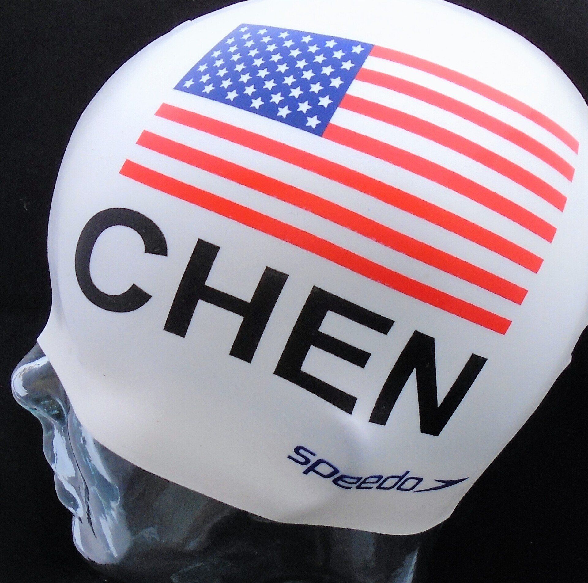 A speedo swim cap with the name chen on it