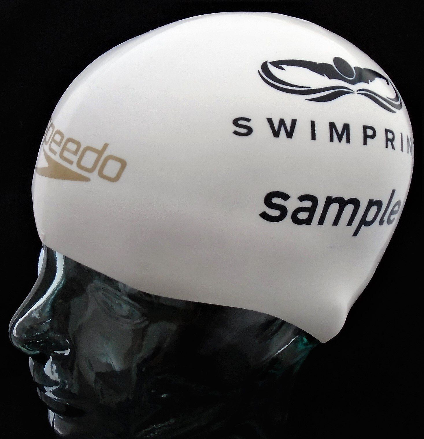 A white speedo swim cap is on a mannequin head