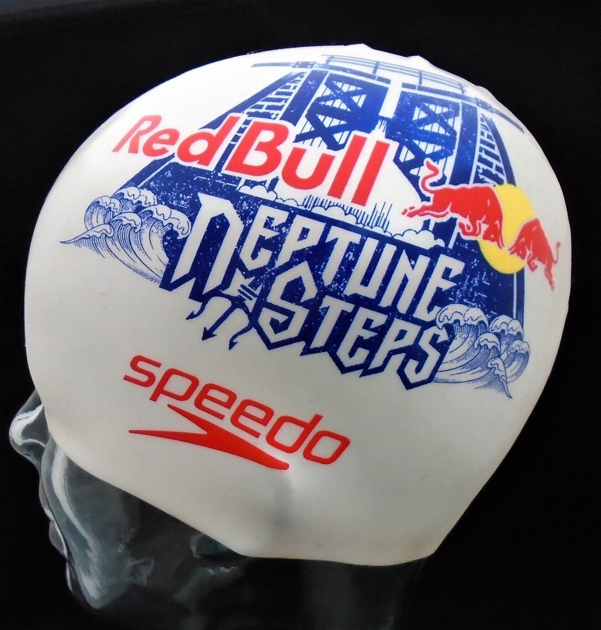 A speedo swim cap that says red bull on it