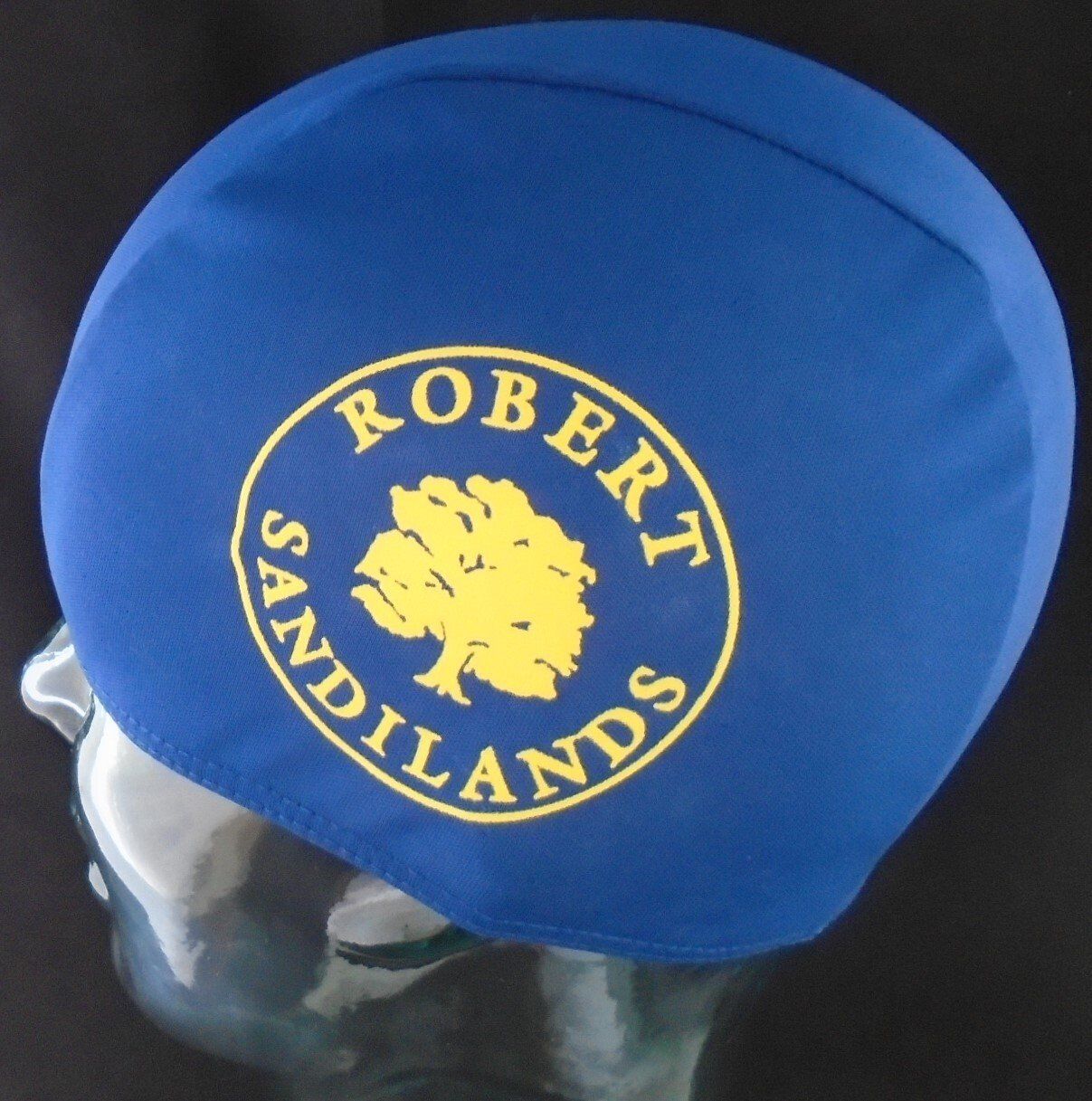 A blue hat with the words robert sandlands on it