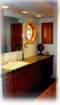 Granite Countertops — Contemporary Custom Log Home With Cabinet And Mirror in Haven, PA