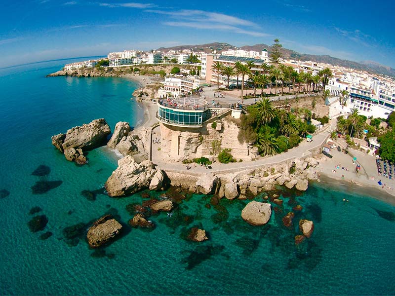 An aerial view of Nerja in the middle of the ocean.
