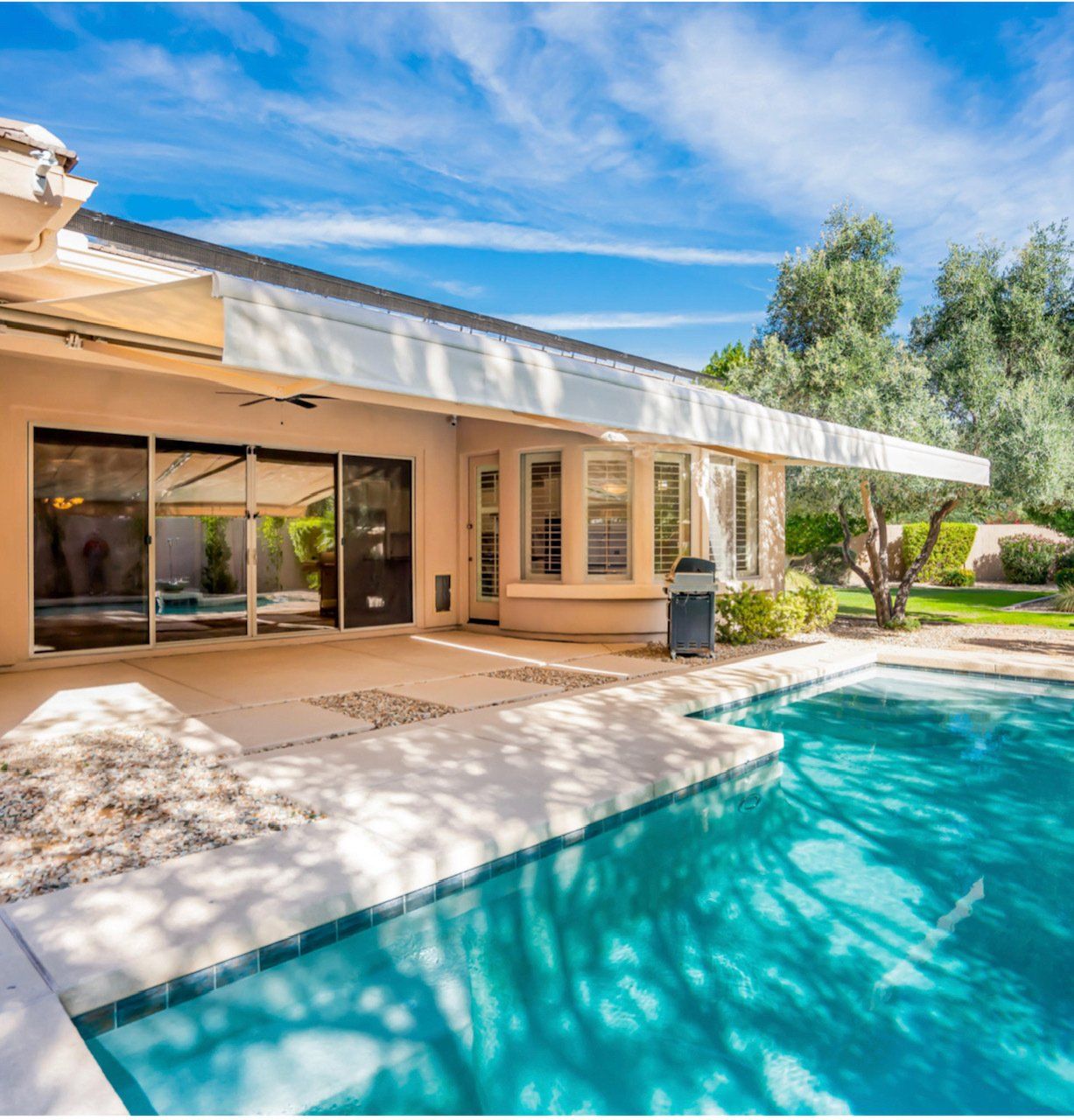 custom white patio awning near a swimming pool in Phoenix, AZ