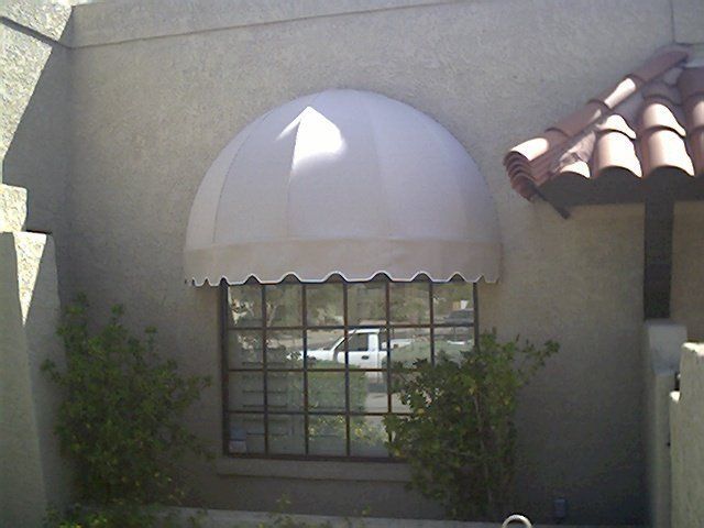 convex/concave style window awning on Phoenix, AZ home