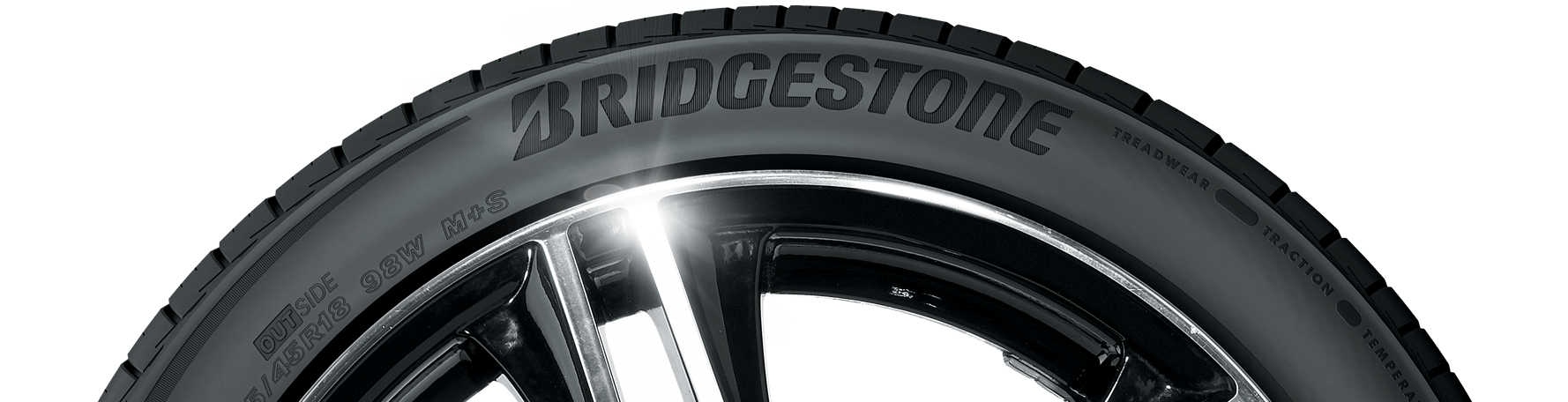 Black Bridgestone tire with the brand name in white letters on the tire.