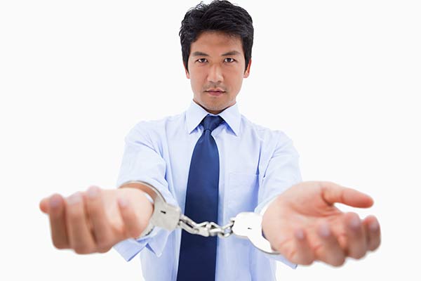 DWI — Man Showing His Hands Locked On a Handcuffs in Temple, TX