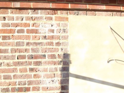 partially plastered bricks