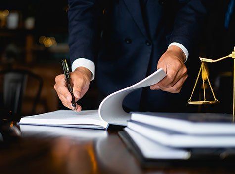 Workers Compensation Cases — Lawyer Signing A Documents in Milwaukee, WI Workers Compensation Cases — Lawyer Signing A Documents in Milwaukee, WI