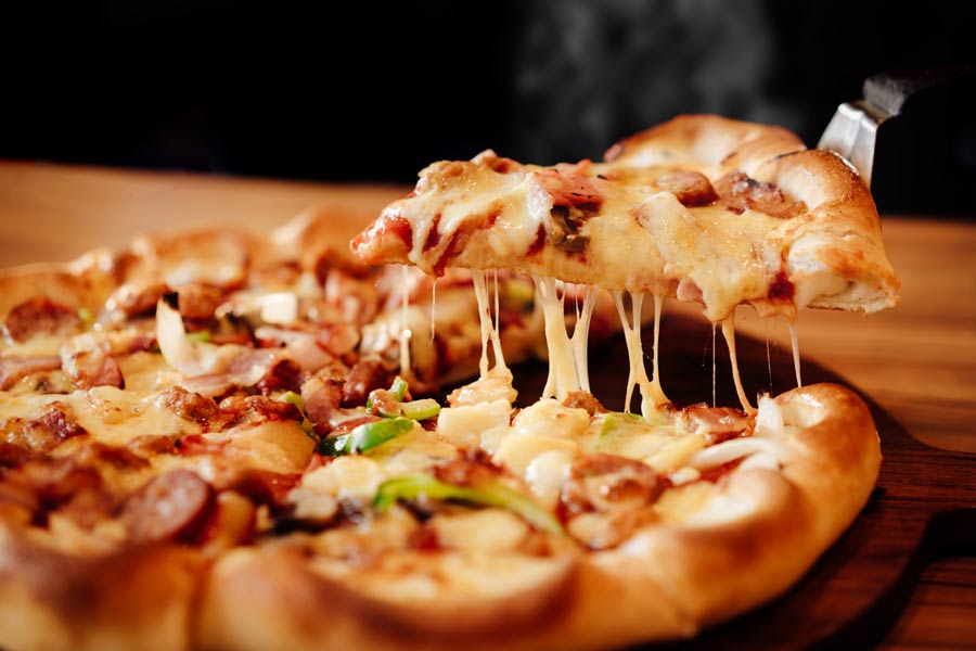 Homemade Pizza — Slice Of Pizza Cheese Crust Seafood Topping Sauce in Sturgen Lake, MN Homemade Pizza — Slice Of Pizza Cheese Crust Seafood Topping Sauce in Sturgen Lake, MN