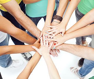 hands joined together in support