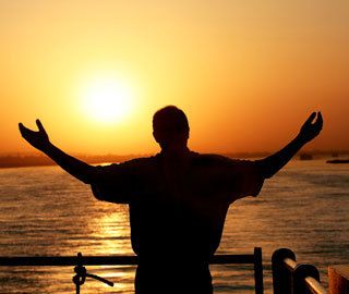 open arms at sunset