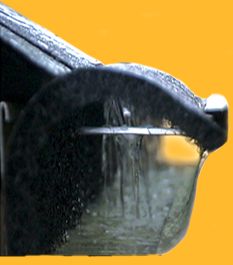 Gutter Installation: Water collecting in seamless gutter
