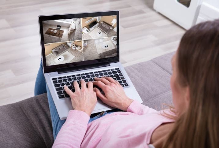 Woman Checking CCTV Footage — Menlo Park, CA — A A Lock And Alarm