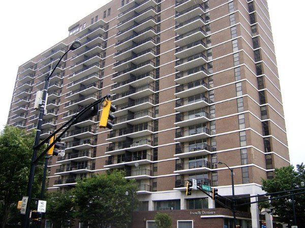 A tall building with a street light in front of it