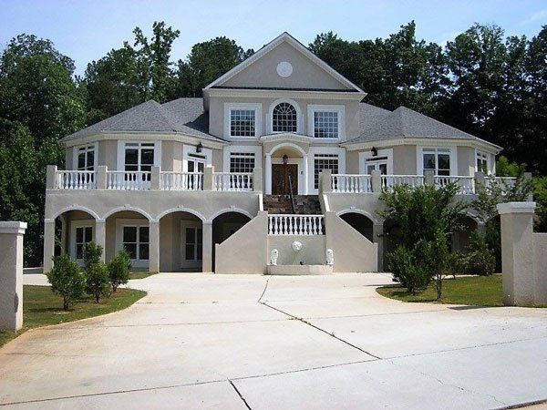 A large house with a driveway leading to it