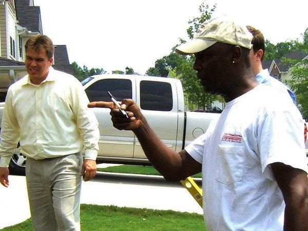 A man in a white shirt with the word johnson on it