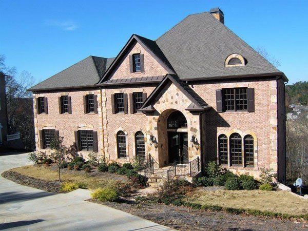 A large brick house with a gray roof
