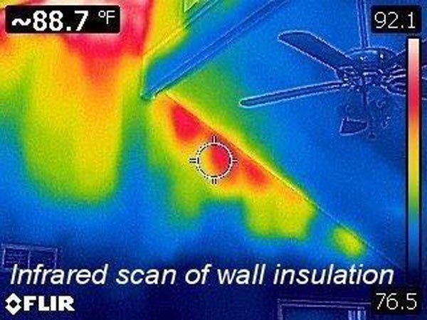 An infrared scan of a wall insulation with a ceiling fan.