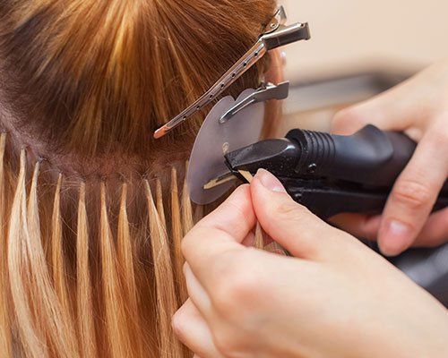Hair Extensions — Blonde Woamn in a Beauty Salon in Waterbury, CT