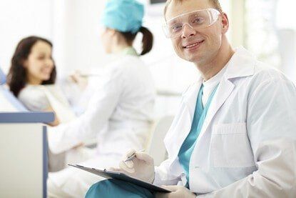 Dentist Holding a Note - Cosmetic and General Dentistry in Newton, NJ Dentist Holding a Note - Cosmetic and General Dentistry in Newton, NJ