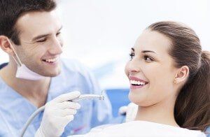 Dentist and a woman patient - Dental Care in Newton, NJ Dentist and a woman patient - Dental Care in Newton, NJ