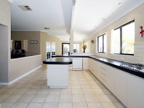 kitchen before renovation with linoleum floors