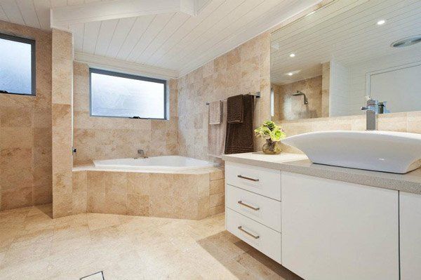 bathroom with granite flooring and countertops