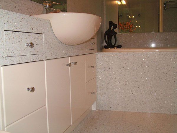 bathroom with white cupboards