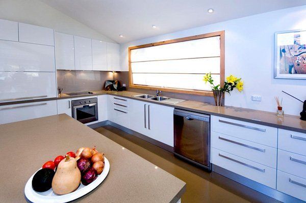 kitchen with white cupboards and granite countertops