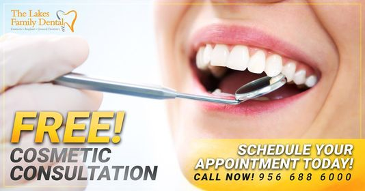 A woman is getting her teeth examined by a dentist