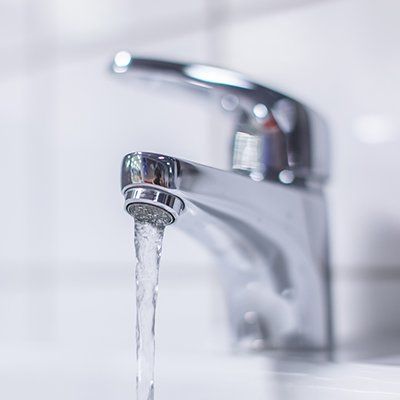 Backflow Repair — Open Faucet in Sink in Battle Creek, MI Backflow Repair — Open Faucet in Sink in Battle Creek, MI