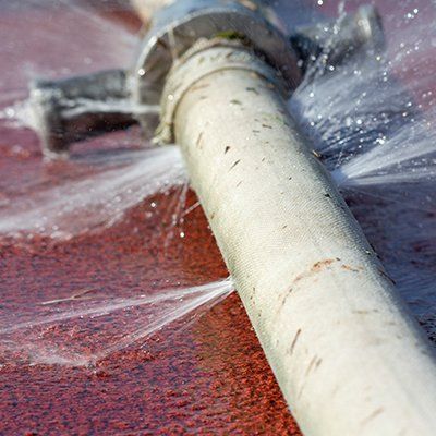Water Line — Bursting Water from Pipe Hole in Battle Creek, MI Water Line — Bursting Water from Pipe Hole in Battle Creek, MI