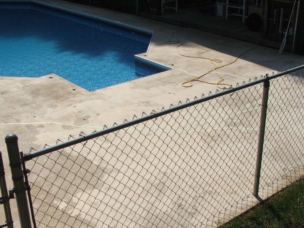 Pool Area With Metal Hence — Jamestown, NC — Decorative Concrete Unlimited Inc