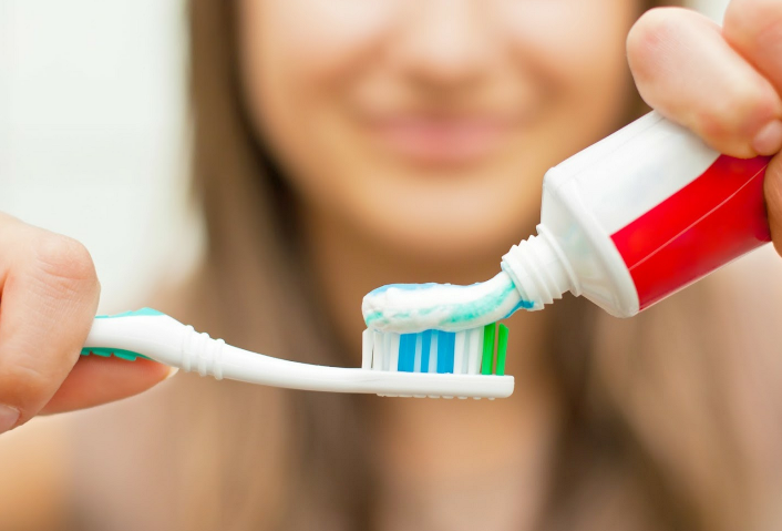 A Girl Using A Toothbrush — Washinton, DC — Michael G. Landy DDS