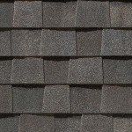 Dark gray asphalt shingles in a repeating pattern.