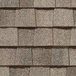 Close-up of brown asphalt roof shingles.