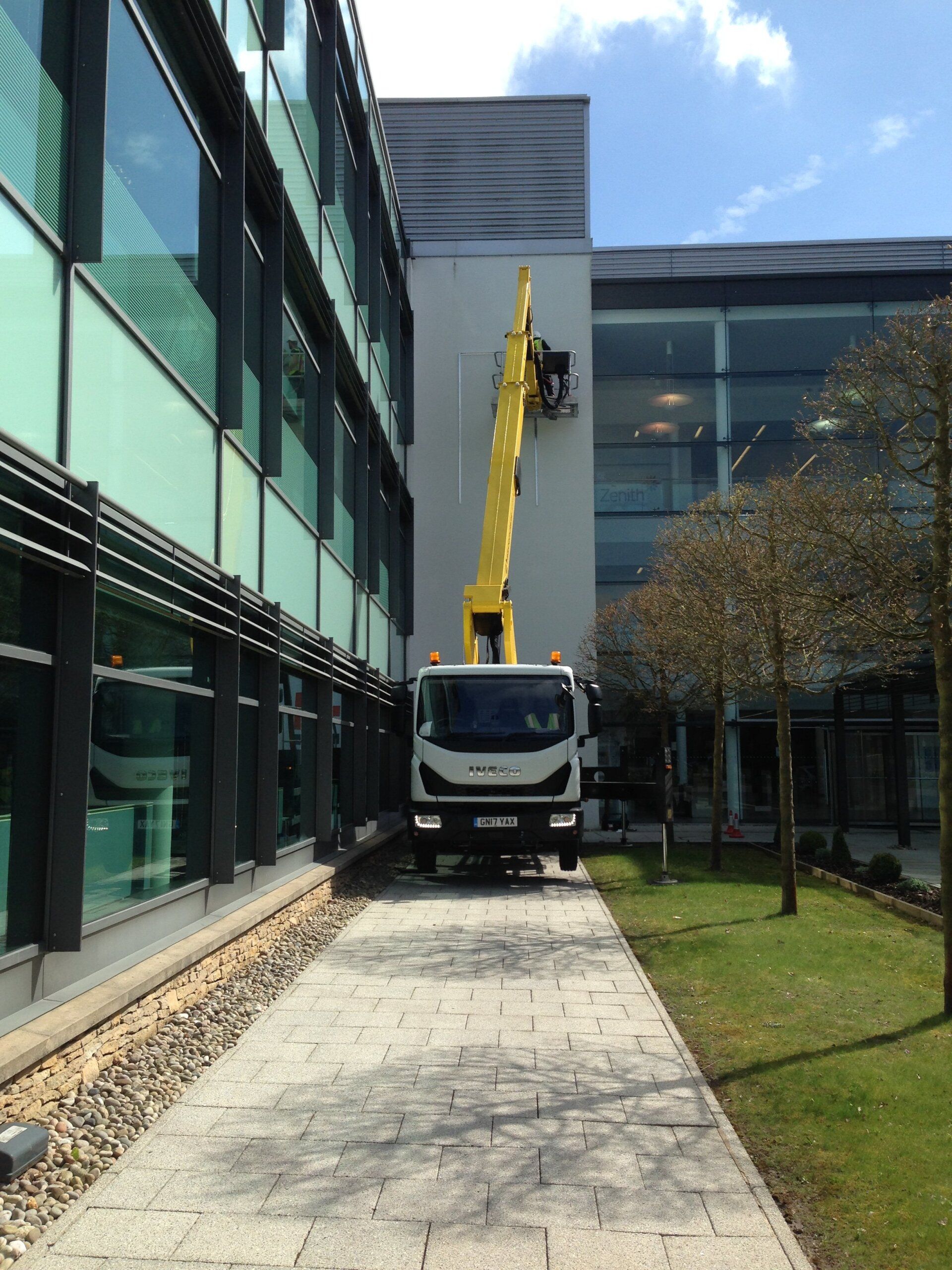 Cherry picker accessing office building