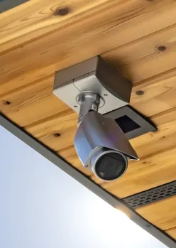Picture of a security camera and text reading get peace of mind with a personalized security solution from 4plus