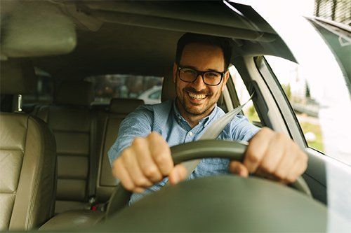 Man Driving His Car | Indianapolis, IN | HIX Wrecker Service, Inc. Wrecked Car Towing | Indianapolis, IN | HIX Wrecker Service, Inc.