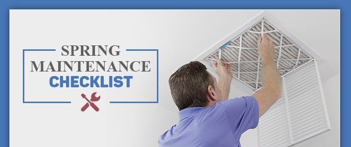 Man changing filter in an air vent