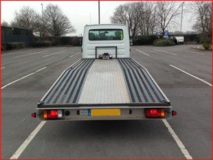 the back of a white recovery truck