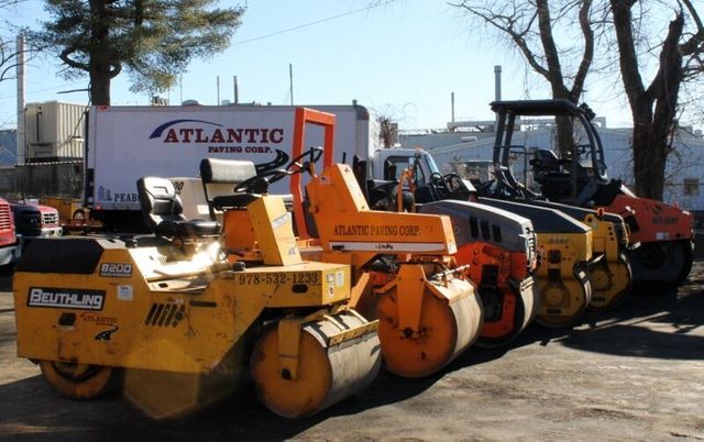 Row Of Compact Paving Truck — Peabody, MA — Atlantic Paving Corp.