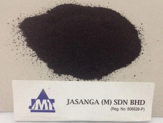 A pile of black powder next to a sign that says jmx
